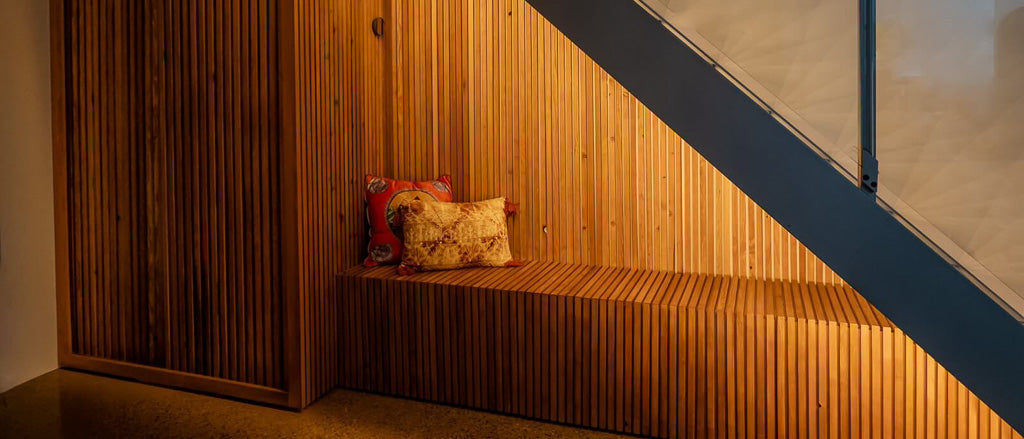 Curated home interior featuring sculptural furniture and warm natural light